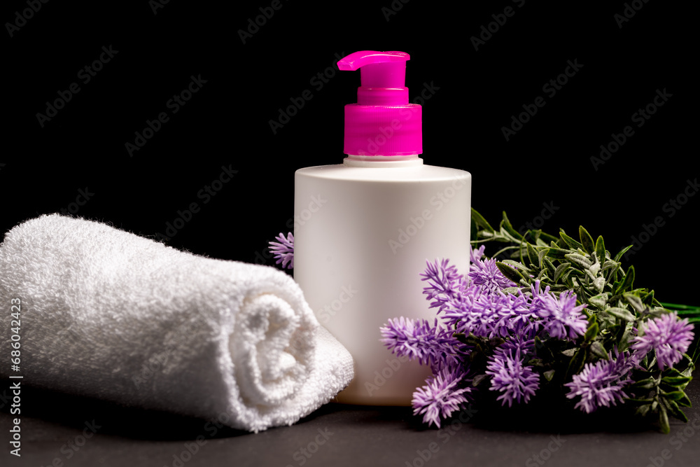Beauty treatment and relaxation concept.towels with soap and lavender background for beauty salon, beauty and aromatherapy,spa massage, lavender , soap on black background