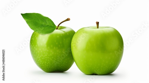 With clipping path, one green apple and quarter piece are isolated on a white background.