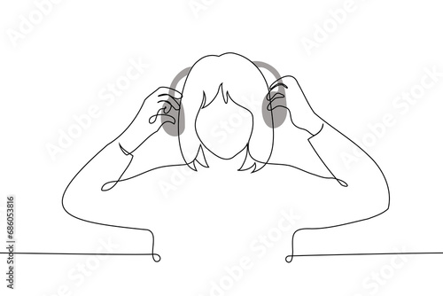 woman stands raising her on-ear headphones or putting them on - one line art vector. concept taking off or putting on headphones