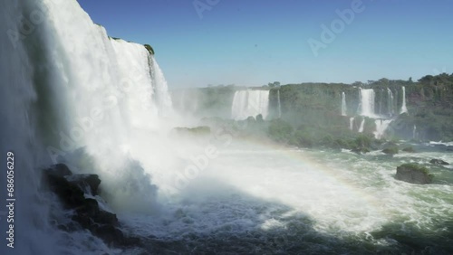 The Iguazu Falls are located at the border between Brazil and Argentina and are one of the seven wonders of the world, a popular ravel destination in the rainforest of south America. photo