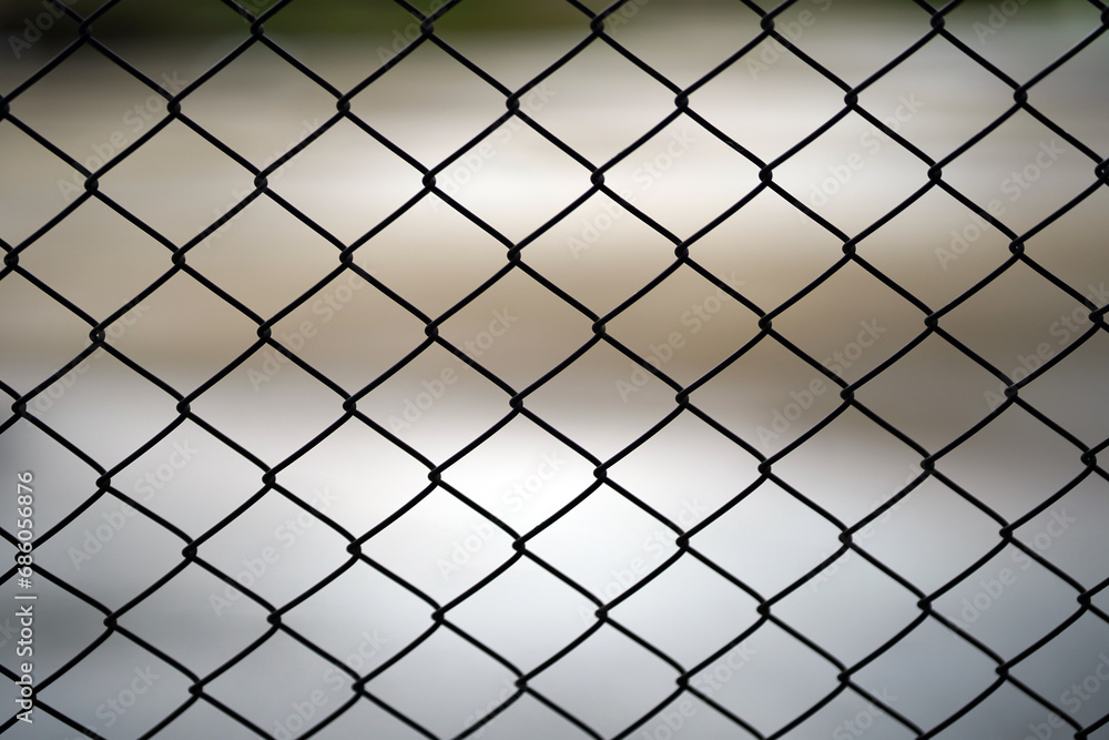 Close-up of wire mesh used as a cage or fence. Close-up of wire mesh used as a cage or fence.