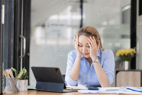 Wallpaper Mural Young asian businesswoman stressed, Tired from work, Overthinking from working. Torontodigital.ca