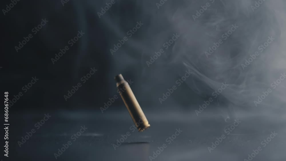 Bullet Casing Descending with Swirling Smoke in Background Bullet Casing Descending with Swirling Smoke in Background