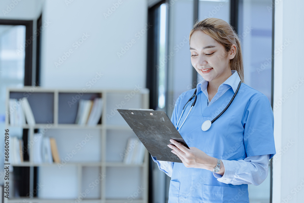 Asian female doctor with patient clipboard at hospital, Medicine and healthcare concept. Asian female doctor with patient clipboard at hospital, Medicine and healthcare concept.
