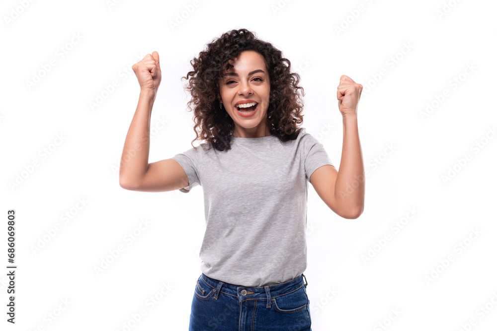 portrait of a young joyful 30 year old caucasian woman in a gray t-shirt with a mockup for printing on a white background with copy space portrait of a young joyful 30 year old caucasian woman in a gray t-shirt with a mockup for printing on a white background with copy space