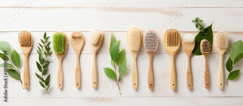Eco friendly bamboo brushes for washing wooden scoops and spoon zero waste nature inspired flat lay Copy space image Place for adding text or design photo
