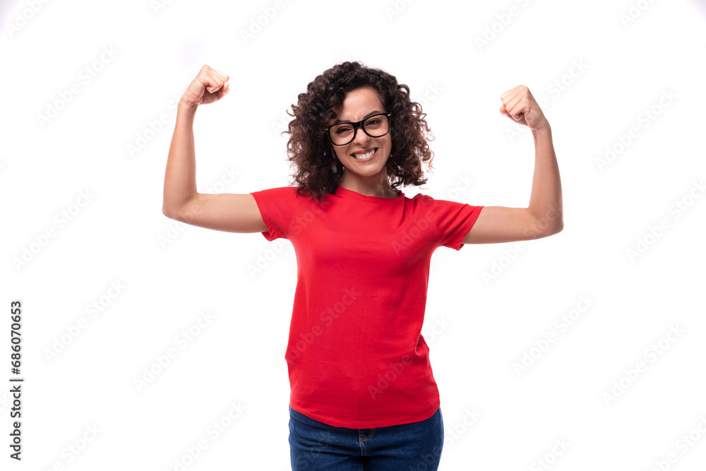young slender curly brunette woman dressed in a red t-shirt with space for printing identities young slender curly brunette woman dressed in a red t-shirt with space for printing identities