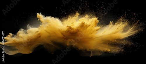 Explosion of small sand wave of golden grains abstract flying cloud yellow silica splash isolated black high speed shot Copy space image Place for adding text or design photo