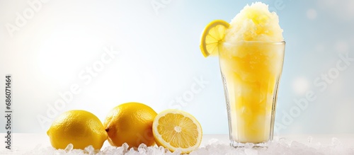 Front view of a tall glass with lemon slush fruit and crushed ice on a white table with an isolated background Copy space image Place for adding text or design