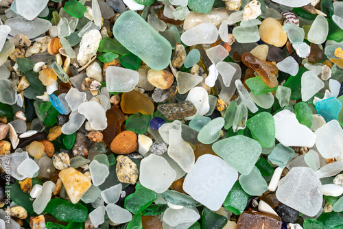 Colored crystals eroded by the sea in the beach of the crystals in the silleiro cape in Pontevedra photo