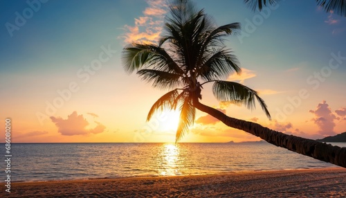 Fototapeta Naklejka Na Ścianę i Meble -  Palm tree on tropical beach with blue sky and white clouds abstract background