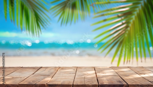 Empty wooden table and palm leaves