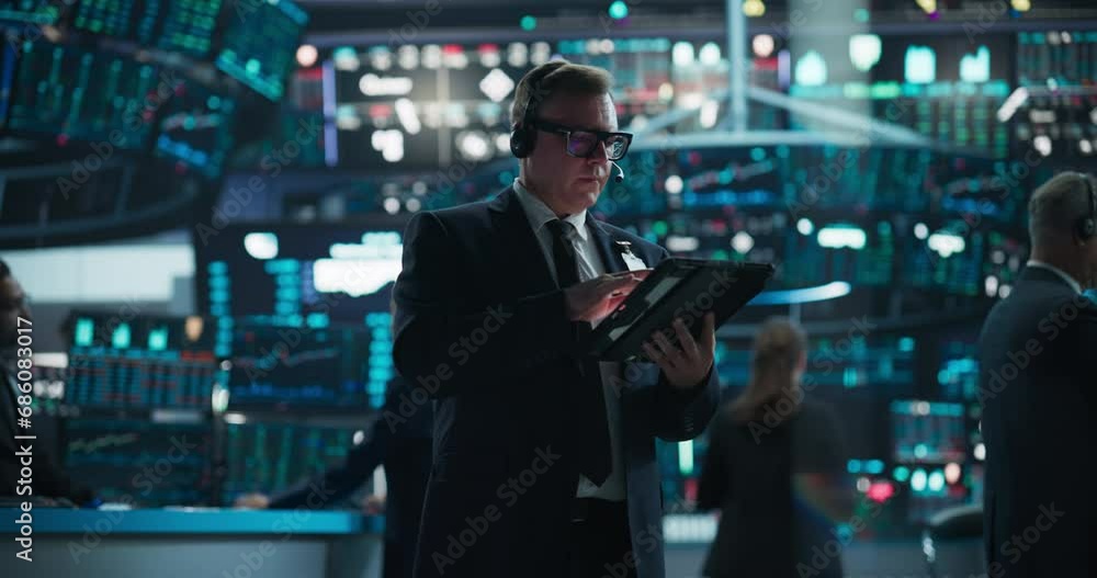 Portrait of a Successful Stock Exchange Manager Working in Modern Office. Proactive Trader Browsing Internet on a Tablet Computer, Using Software with Stock Market Data Prediction Portrait of a Successful Stock Exchange Manager Working in Modern Office. Proactive Trader Browsing Internet on a Tablet Computer, Using Software with Stock Market Data Prediction