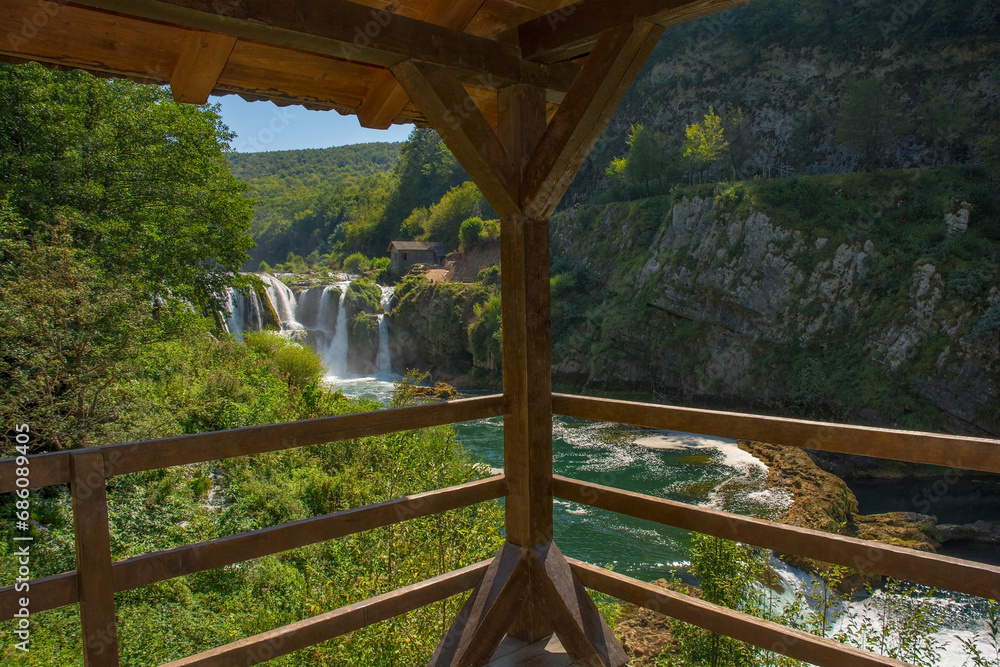 A viewing platform overlooking Strbacki Buk, a terraced waterfall on the Una River on the border between the Federation of Bosnia and Herzegovina and Croatia. Early September A viewing platform overlooking Strbacki Buk, a terraced waterfall on the Una River on the border between the Federation of Bosnia and Herzegovina and Croatia. Early September