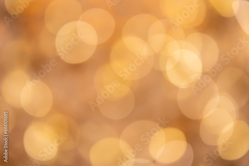 Abstract bokeh on a golden background. Abstract christmas background with bokeh.  Abstract background with bokeh. © Photo by mQ