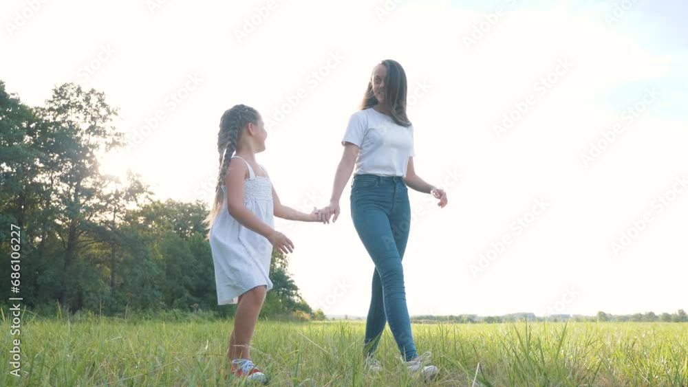 kids toddler dream of walking together in park at sunset. happy kids park concept. two sisters are playing in green park summer for walk. Children are having fun on summer day walking on green grass. kids toddler dream of walking together in park at sunset. happy kids park concept. two sisters are playing in green park summer for walk. Children are having fun on summer day walking on green grass.