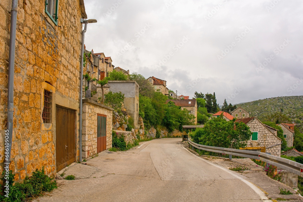 A street of historic stone houses in Loziscz Village in the centre of Brac Island in Croatia