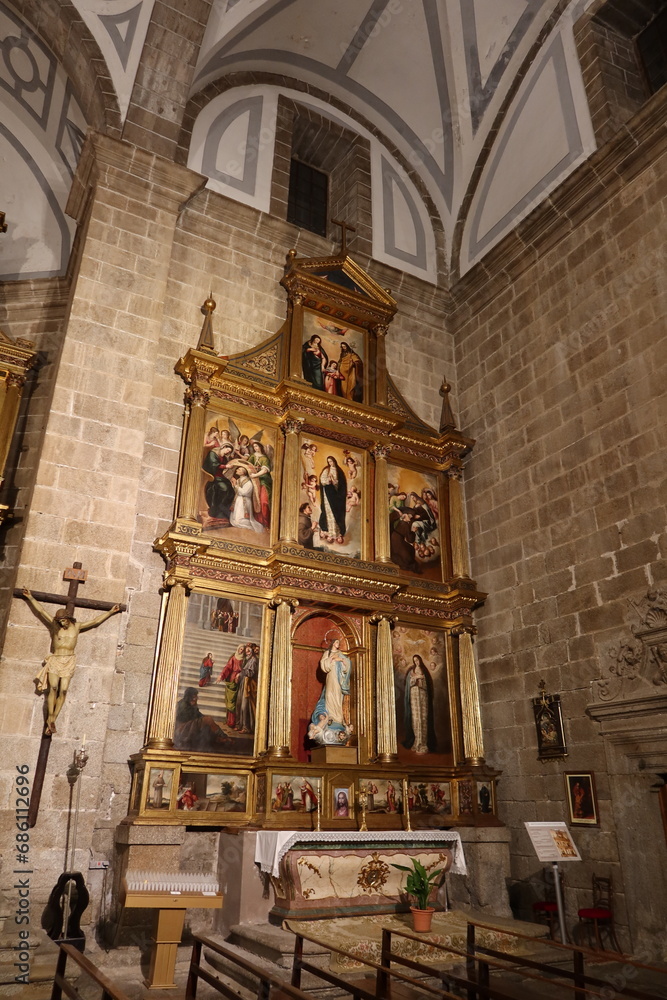 Cebreros, Avila, Spain, November 28, 2023: Side altar with images of the mother of God in the Santiago Apostol Church, 16th century, in the town of Cebreros, Avila, Spain