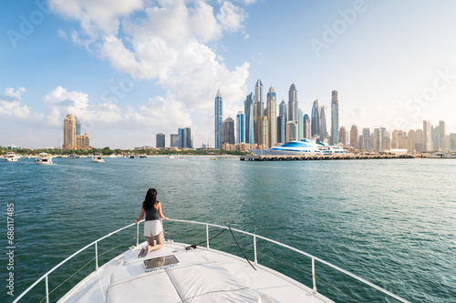 Woman Enjoying a Sunset Yacht Ride in Dubai Marina Harbor in the UAE