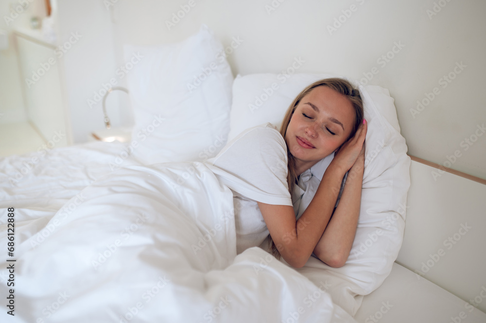 Cute long-haired girl sleeping and looking peaceful Cute long-haired girl sleeping and looking peaceful