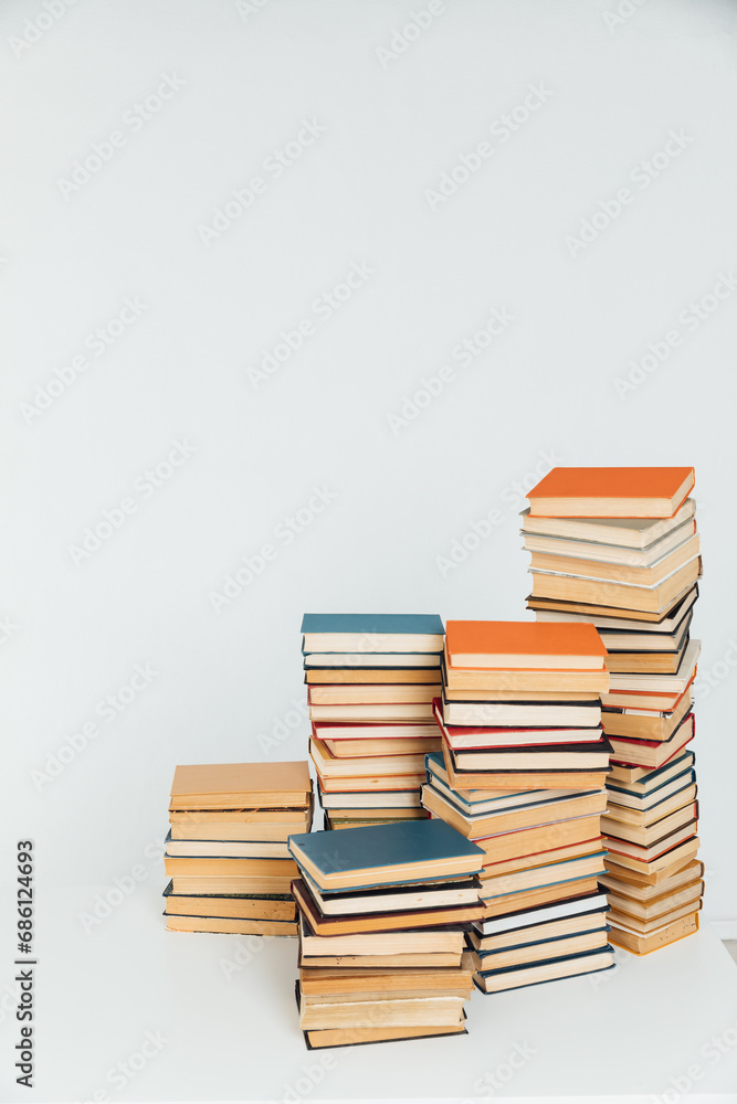 Many Books Piles. Hardback books on wooden table. Back to school. Many Books Piles. Hardback books on wooden table. Back to school.