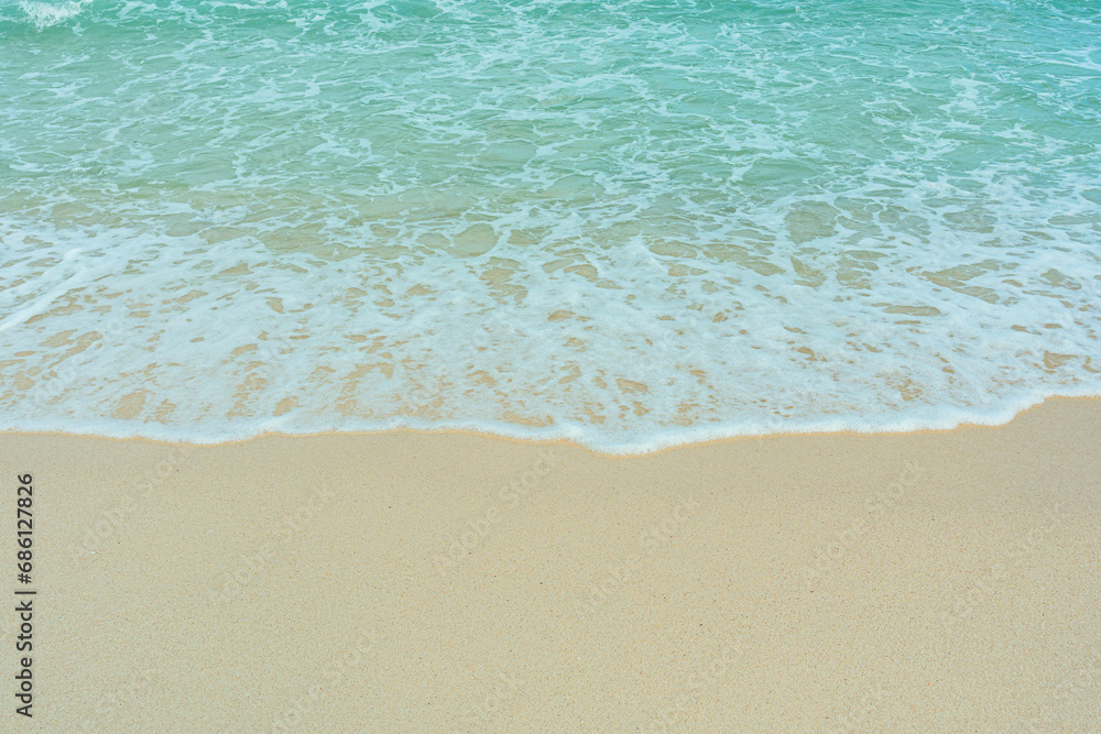 Soft wave of blue ocean on sandy beach. Summer vacation in island. clear azure water Background.