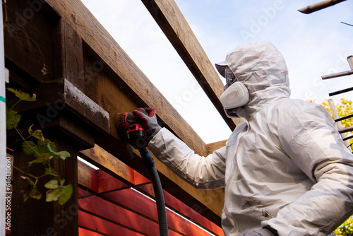 Foto Asian man in full body hazmat suit, respirator mask, gloves, safety glasses gogg