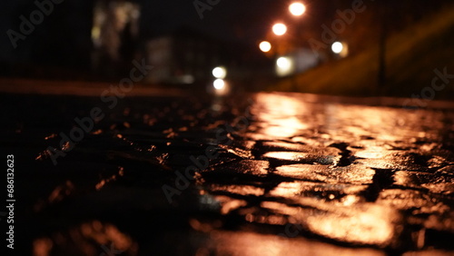 Cobblestone street at night reflection