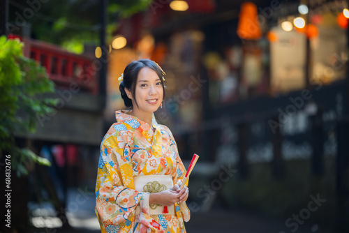 Woman wear yellow kimono in the Japanese village