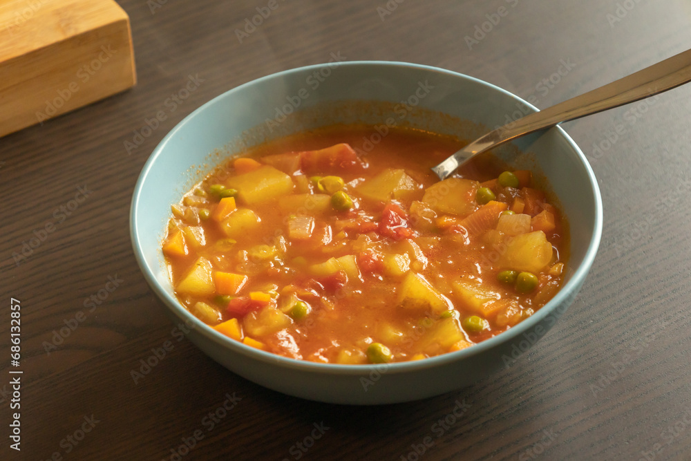 Homemade vegetable soup close up view of vegan healthy soup in a bowl Homemade vegetable soup close up view of vegan healthy soup in a bowl