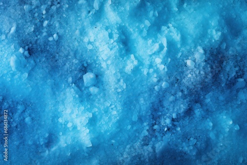  a close up view of blue water with ice on the bottom of the water and bubbles on the bottom of the water.