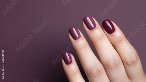 Woman hand with burgundy color nail polish on her fingernails. Burgundy nail manicure with gel polish at luxury beauty salon. Nail art and design. Female hand model. French manicure. Generative AI. photo