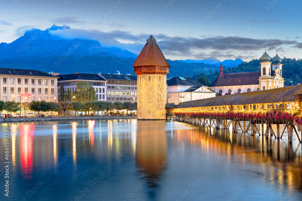 Lucerne, Switzerland with the Chapel Bridge over the River Reuss with Mt. Pilatus.