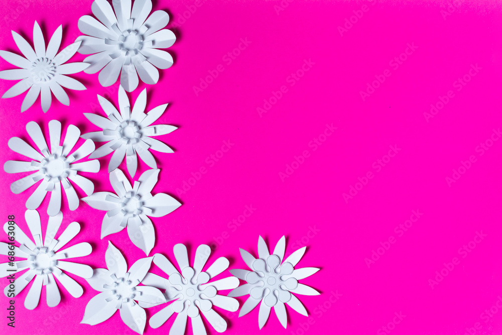 White flowers made of paper on a pink background. Handmade, Paper craft.
