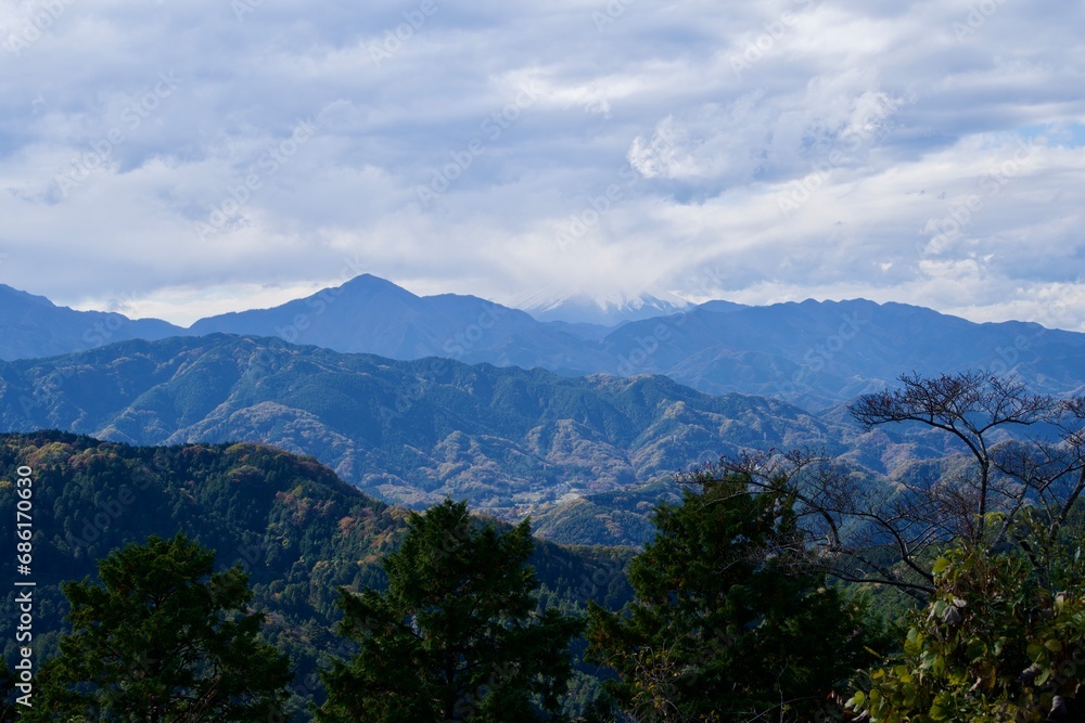 Fuji with clouds and mountains in autumn