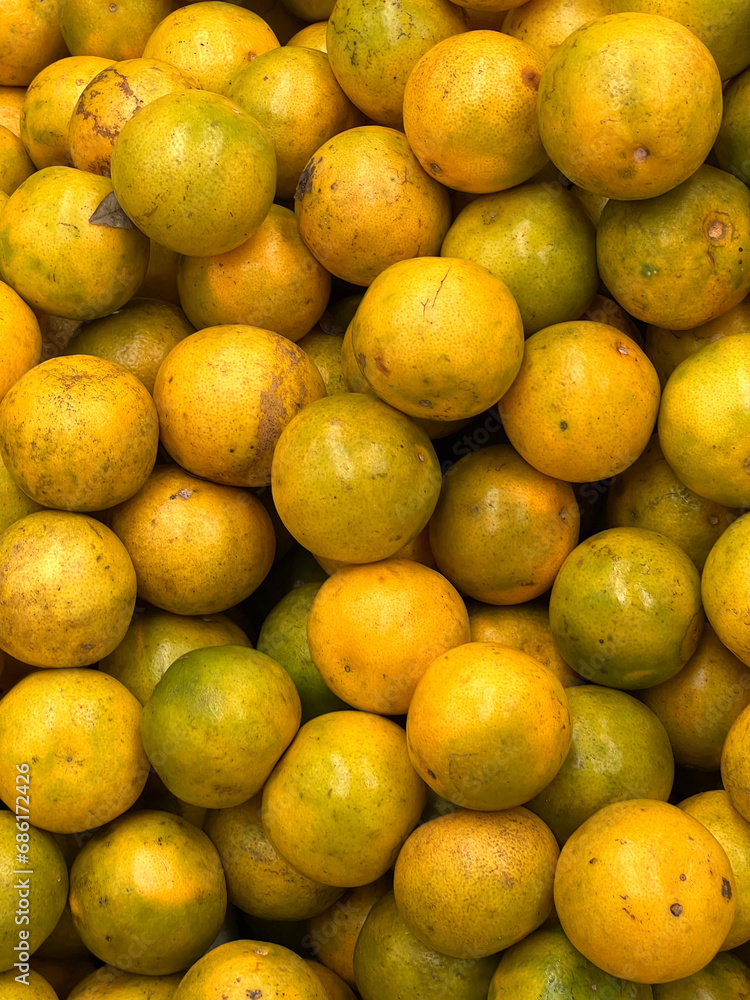 background of fresh ripe yellow orange fruit