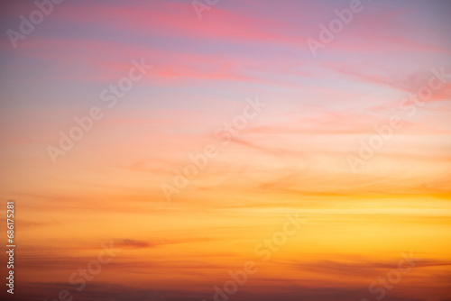 Beautiful of luxury soft gradient orange gold clouds and sunlight on the blue sky perfect for the background, take in everning,Twilight