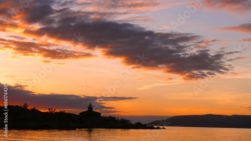 Lighthouse in beautiful orange sunset © moreidea