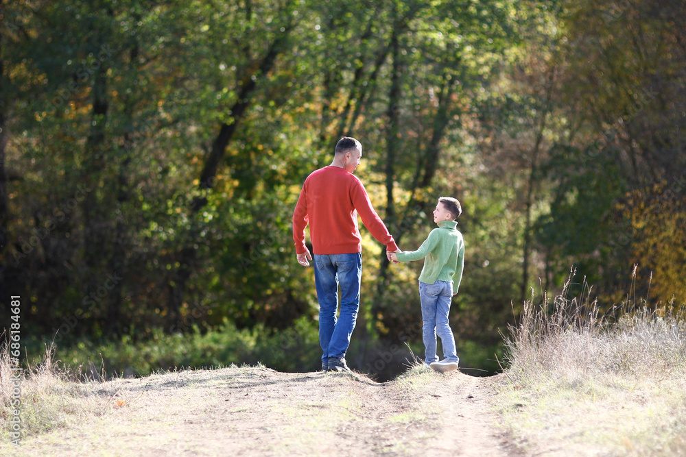 father walks with child emotions concept family