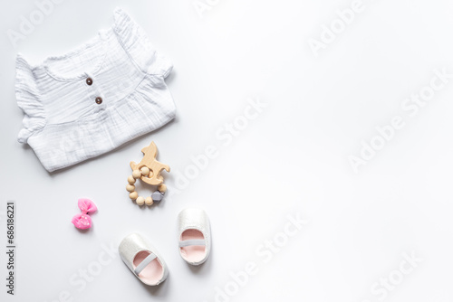Set of baby girl dress and accessories, top view. Kids wear flat lay