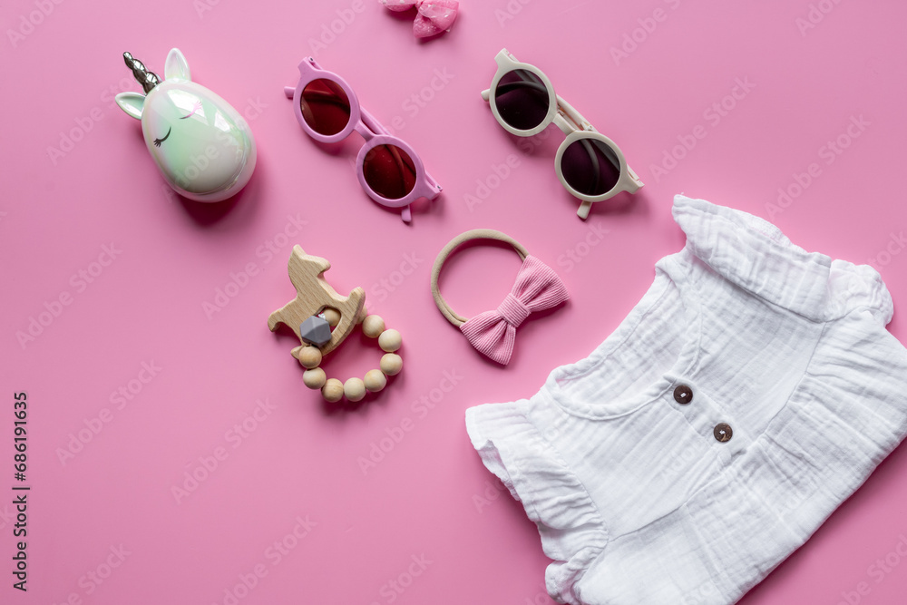 Kids wear flat lay - dress for baby girl with accessories, top view Kids wear flat lay - dress for baby girl with accessories, top view
