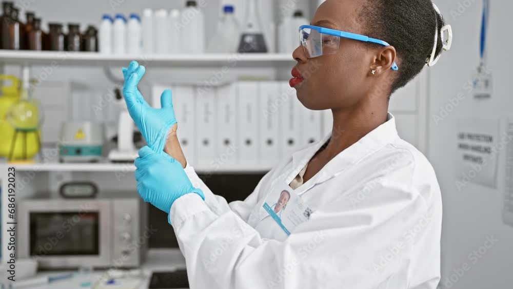 Serious african american woman scientist, donned in gloves, working diligently on medical research in a high-tech lab, embodying the beautiful essence of professionalism Serious african american woman scientist, donned in gloves, working diligently on medical research in a high-tech lab, embodying the beautiful essence of professionalism