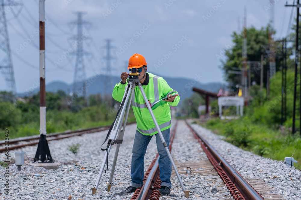 person on railway. construction worker on site. construction worker on site. construction worker on a construction site.