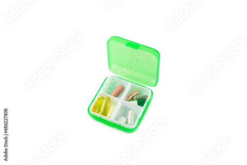 Vitamins and supplements. A variety of vitamin tablets in a tablet box isolated on a white background. Multivitamin complex for every day. Nutritional supplements.Copy space.Vitamins for immunity photo