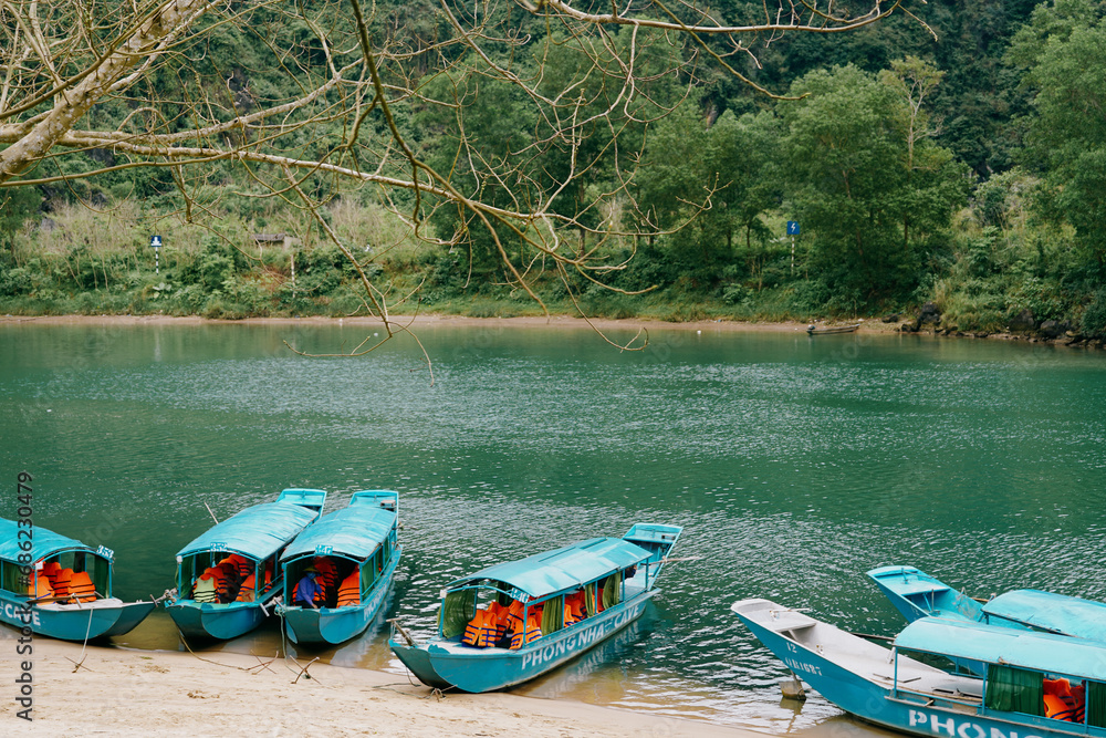 Fototapeta premium Phong Nha traditional blue boats in Vietnam