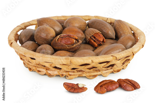 pecan nut in a wicker basket isolated on white background with full depth of field