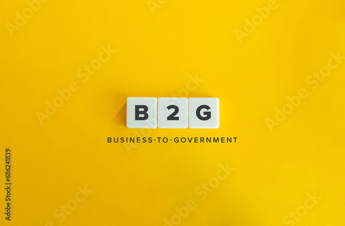 Business-to-government Abbreviation (B2G). Letter Tiles on Yellow Background. Minimalist Aesthetics. photo