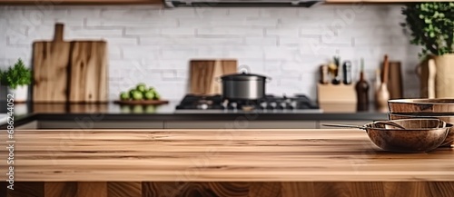 Modern culinary haven. Empty wooden kitchen counter with rustic accents. Homey kitchen elegance. Blurred background of cozy cooking space