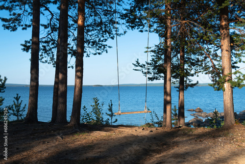 swing in the woods by the lake. Kandalaksha, Murmansk region