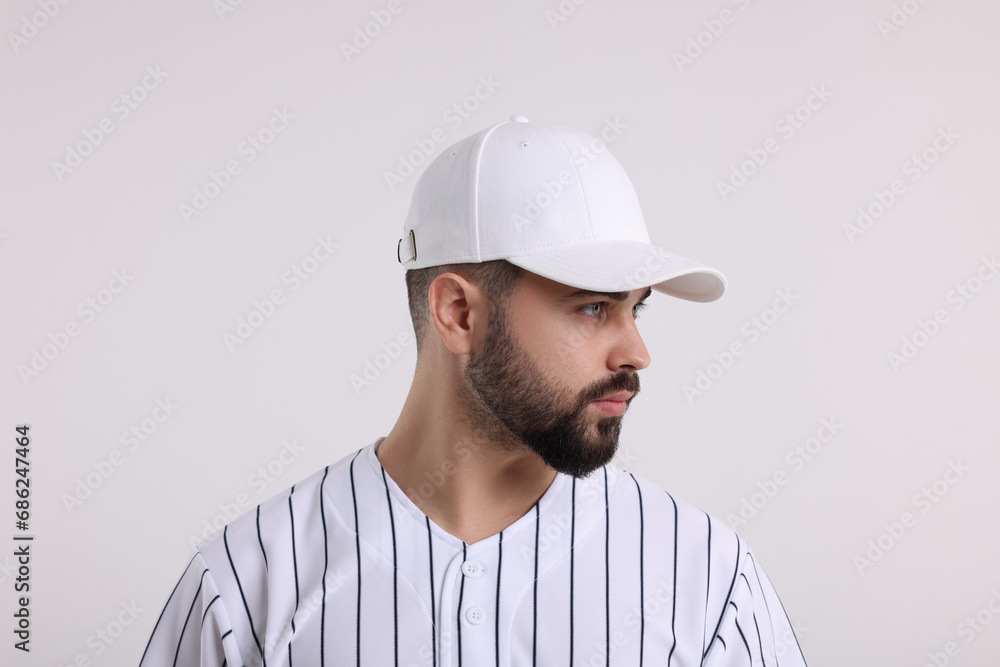 Man in stylish baseball cap on white background Man in stylish baseball cap on white background